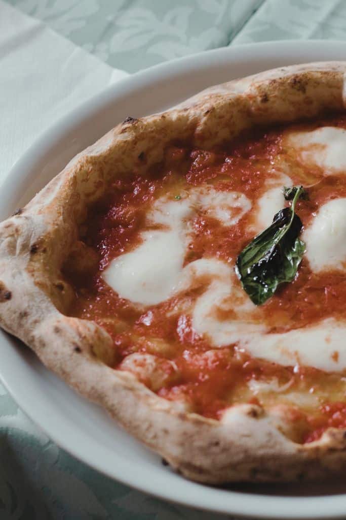 a wood-fired pizza just out the oven, which you can learn to make during certain cooking classes in florence italy