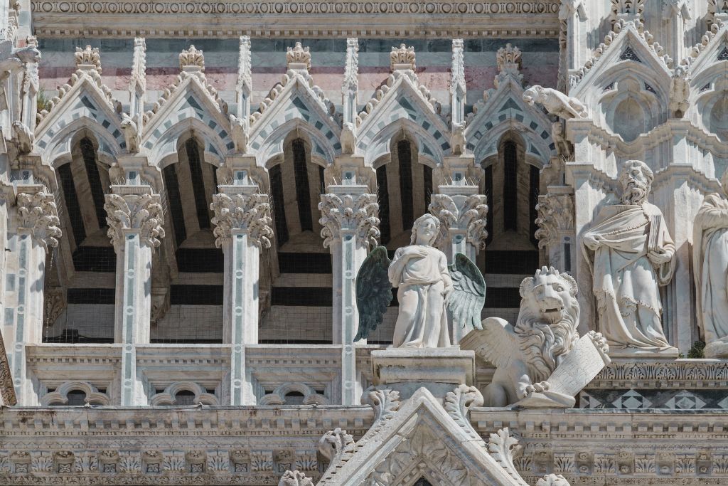 sculptures on the facade of the siena cathedral
