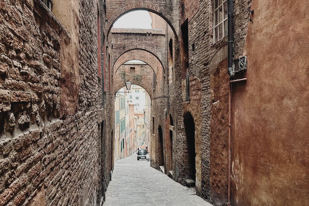 one of siena's many historic streets, which are worth exploring on a florence to siena day trip