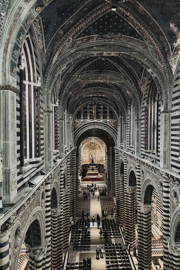 black and white striped interior of the siena cathedral